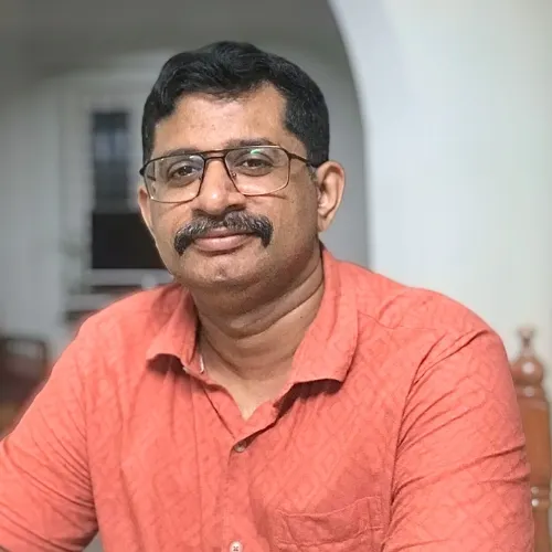 Dr Mathew R John